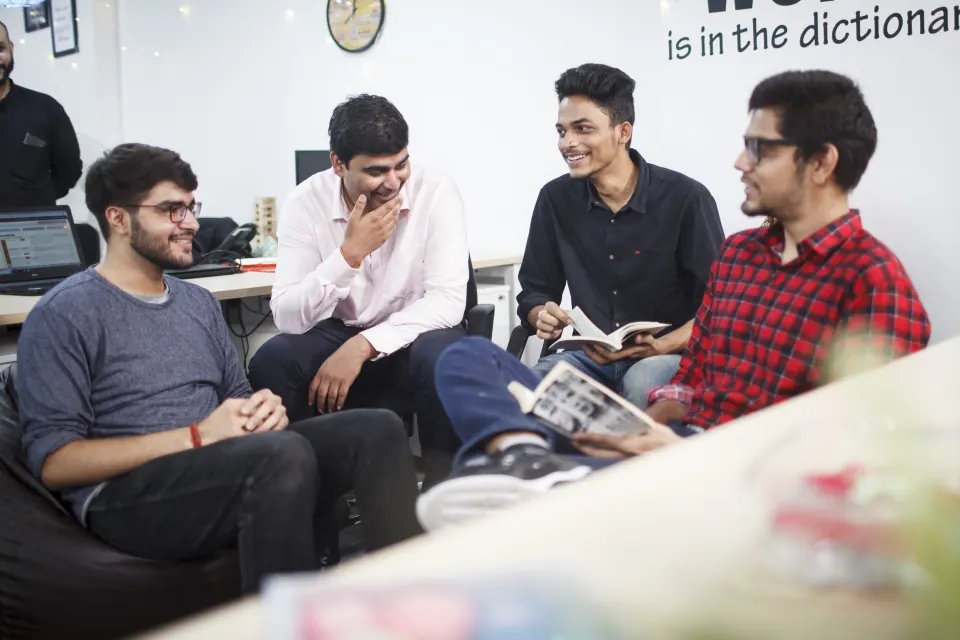 Colleagues chatting in the office