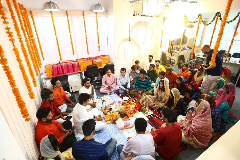 The office gathered for a festive puja