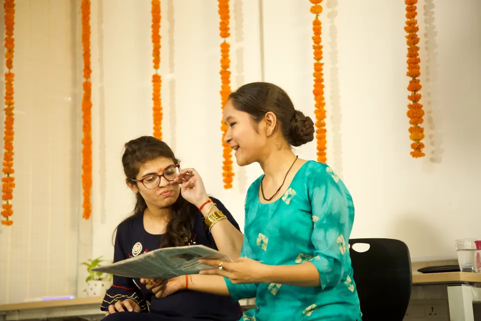 A colleague performing at an office celebration