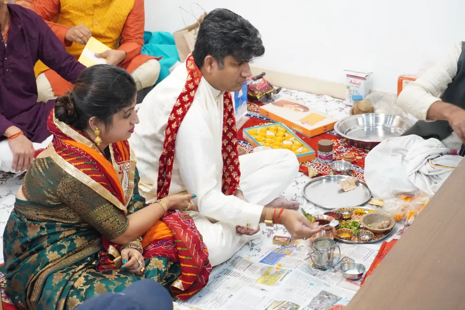 Colleagues performing a puja
