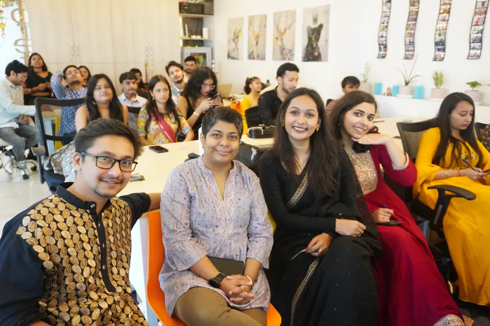 Colleagues in festive wear at their desks