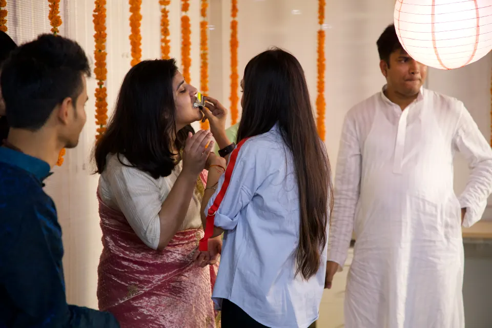 Colleagues sharing sweets at a celebration