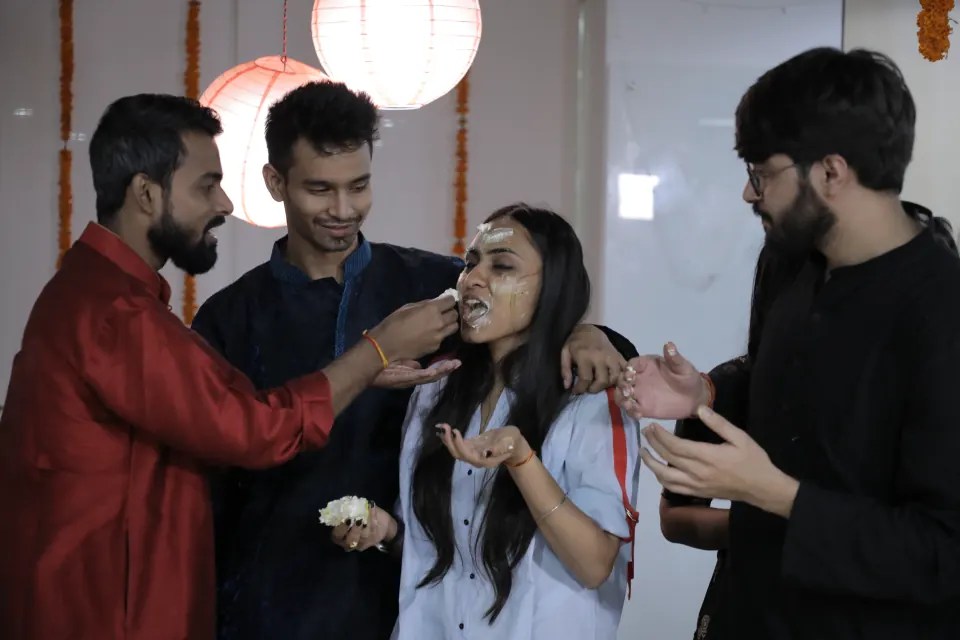 Sharing sweets at an office celebration