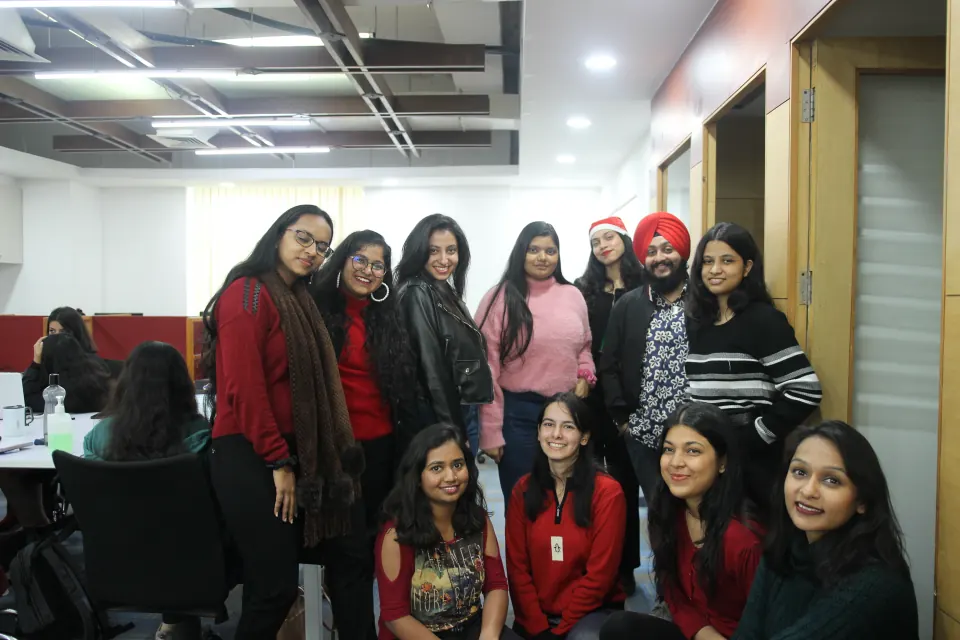 Colleagues dressed in red for Christmas