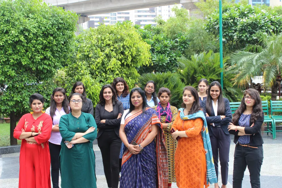 Colleagues in festive wear gathered in the garden