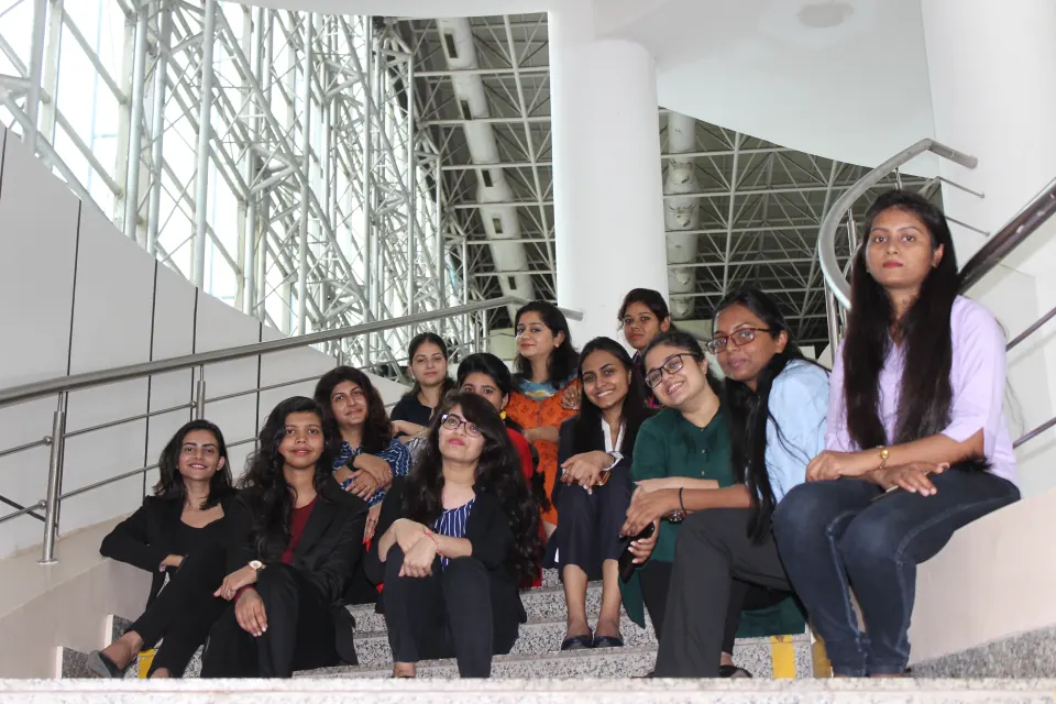 Colleagues together on the office stairs