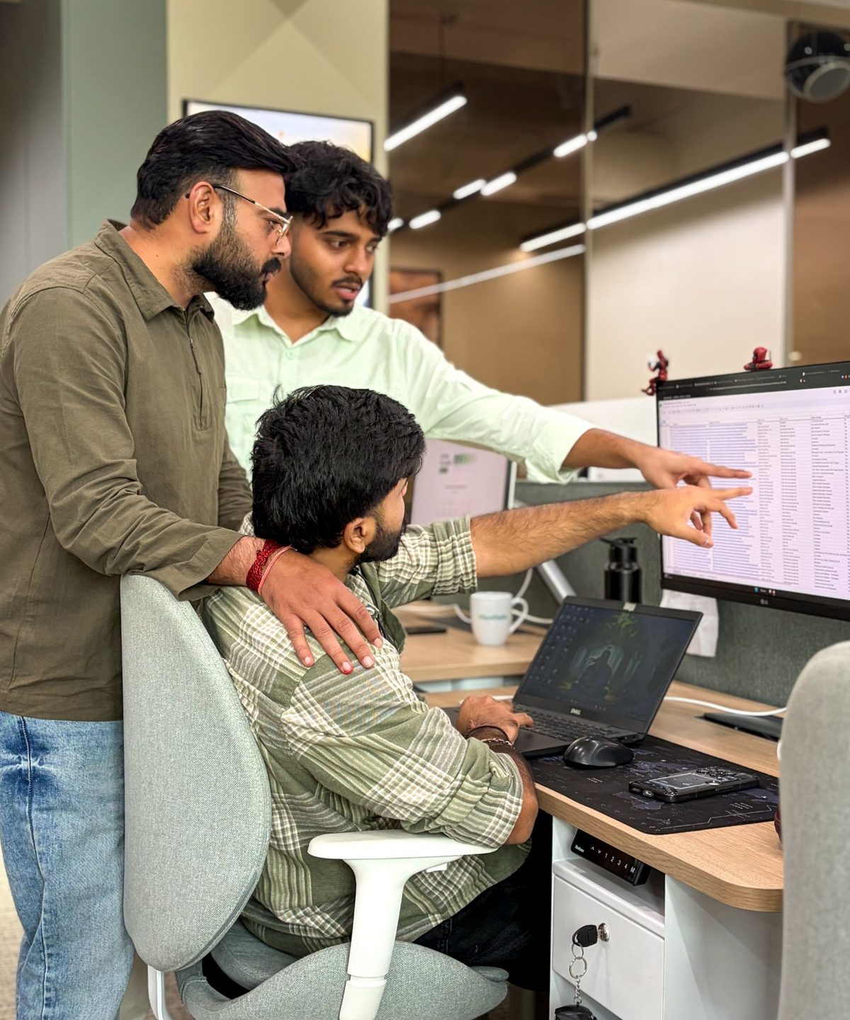 A MoreTasks team lead guiding a colleague through live work on screen